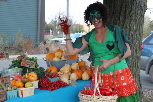 Hether Frayer dressed as “The Fresh Food Fairy.” Proceeds from the calendars will support her work.